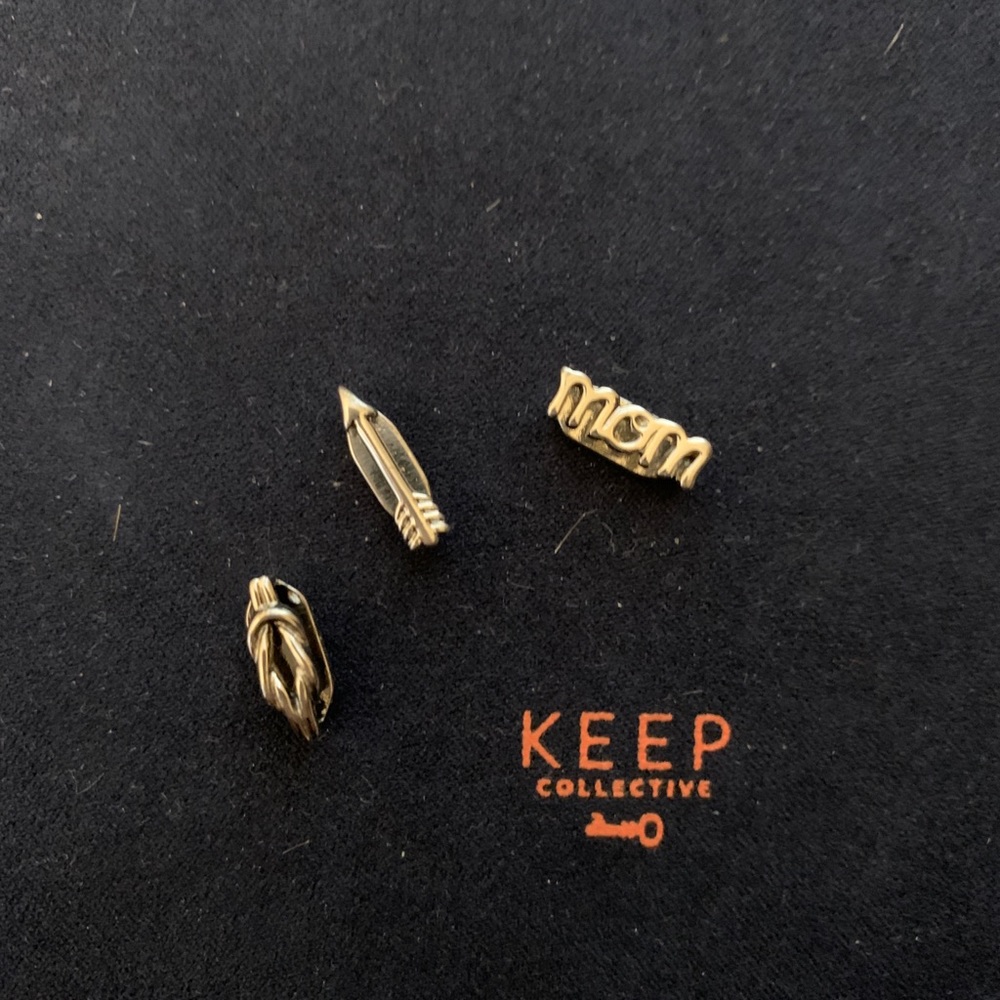 KEEP Collective “mom,” arrow, and knot charms in silver